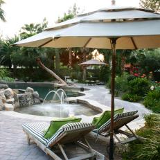 Tropical Pool With Large Patio and Covered Lounge Chairs