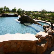 Multi-Level Pool Area With Stone Surround