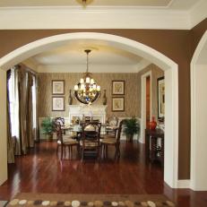 Neutral Traditional Dining Room With Dramatic Archway