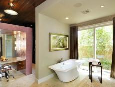Designer Chris Johnson of Design Tec Inc. incorporates a built-in bathtub and functional bathroom design in this spa-like bath retreat.