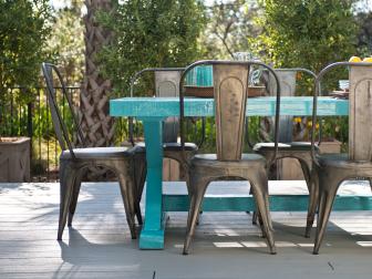 Outdoor Deck Featuring Turquoise Table and Brass Chairs