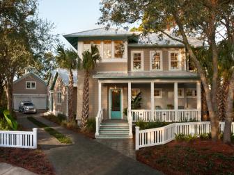 Coastal Home With Porch and White Fence
