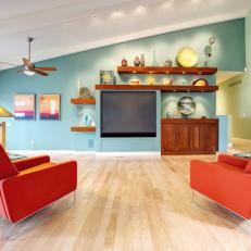Midcentury Modern Blue Living Room With Orange Armchairs
