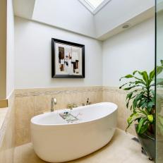 Contemporary Neutral Bathroom With Soaking Tub and Modern Artwork