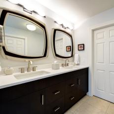 Contemporary Bathroom With Dual Vanity and Framed Mirrors