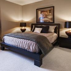 Warmly Lit Beige Bedroom With Platform Bed
