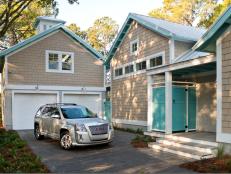 The boathouse-style garage area provides space to unload the car after a day at the beach, store gear, rinse off and refresh before entering the home via a secondary side entrance.