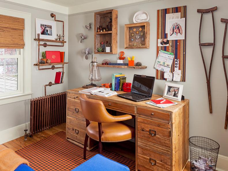 Redesigned study with reclaimed pine desk and vintage medical items.