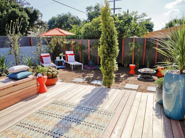 Backyard With Platform Deck, Privacy Fence, Red Umbrella, Pavers
