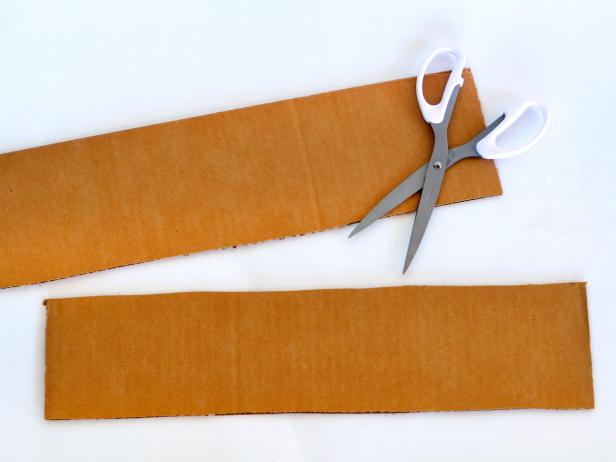Cut one flap in half. Save one half and discard the other.