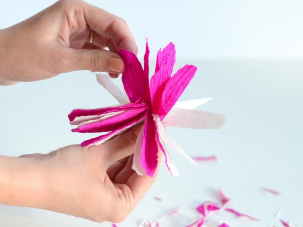 Pull petals apart and crease to create a flower blossom.