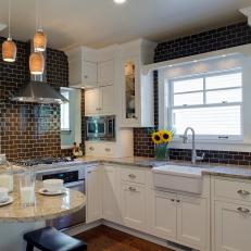 White Kitchen With Peninsula and Brown Subway Tile