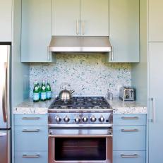 Terrazzo Backsplash in Kitchen With Blue Cabinets 