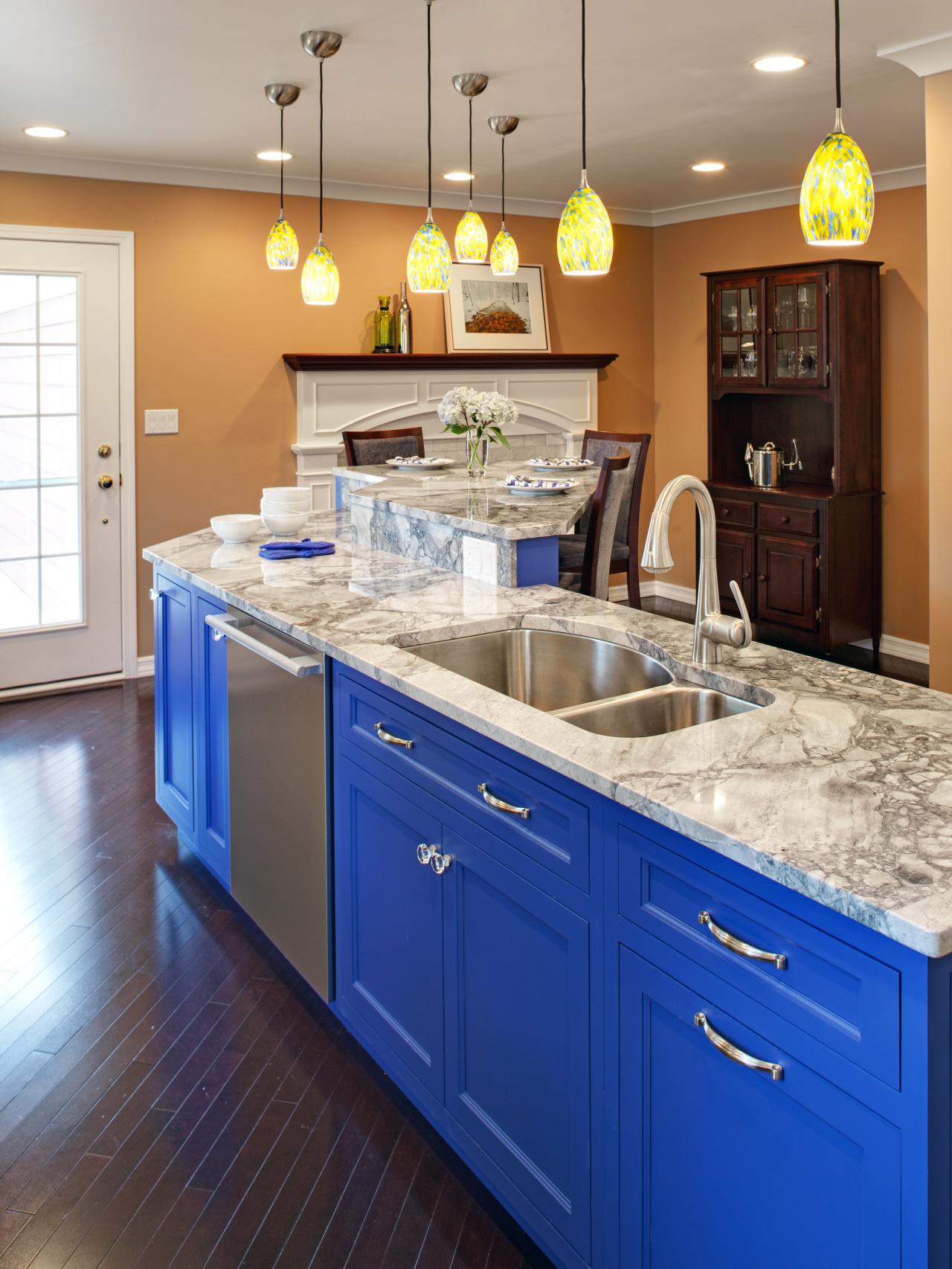 Kitchen With Marble Countertops And Bright Blue Island Hgtv