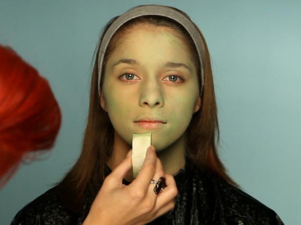To turn your tween into a hip Frankenstein for Halloween, begin with a green cream makeup base. Cover entire face and neck using a sponge. Using a fluffy blending brush and a light green eye shadow, cover the face everywhere the green cream makeup was applied. Add a touch of pink blush to apples of cheeks. Define eyebrows with brown or gray eyebrow pencil. Cover eyelids with a purple or mauve eyeshadow and blend up to crease. Use a slightly lighter shade at the halfway point and blend the colors together. For older girls who are comfortable wearing eye makeup, add black liner and mascara to top and bottom lashes to define them and make the eyes appear larger. Add stitch lines and bolts.