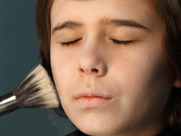 Dust entire face with powder to set face makeup and remove any sheen.
