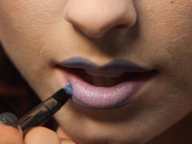 Fill in the center with a light lavender lipstick, and create an ombre effect by making the outside edges an extravagant blue. Tip: If you don't have lipstick on hand in the right colors, you can use eyeliners or wet eye shadows as a substitute.