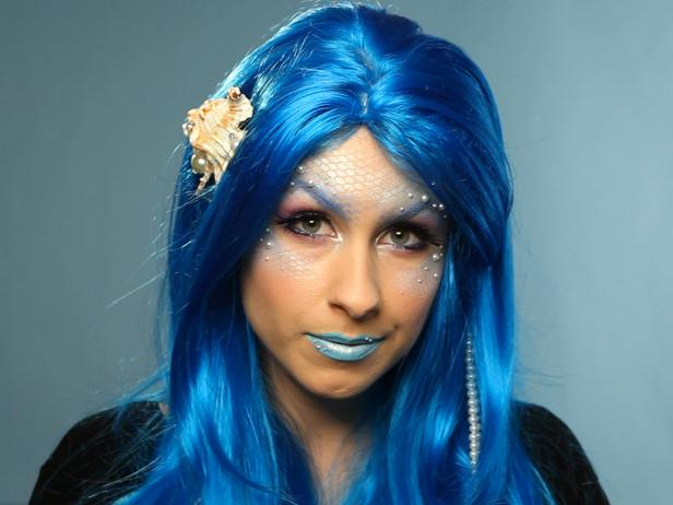 Pick a shade that complements the colors of your scales and embellish the wig with strings of faux pearls and shells to complete this striking mermaid Halloween costume.
