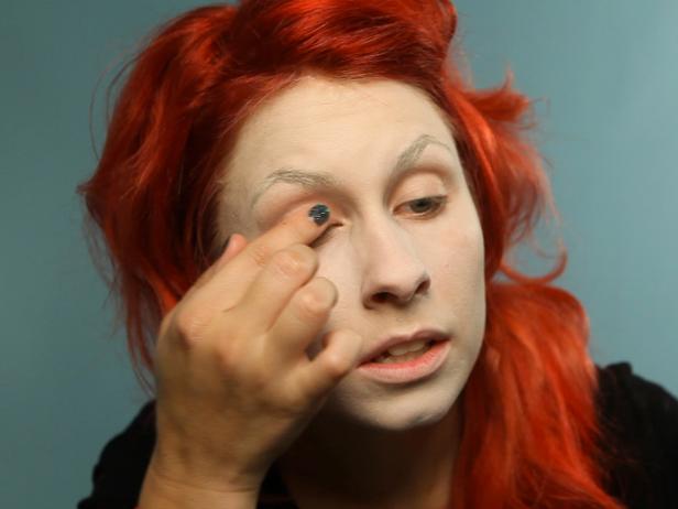 Prime eyelids with shadow primer for the Effie Trinket Halloween look.