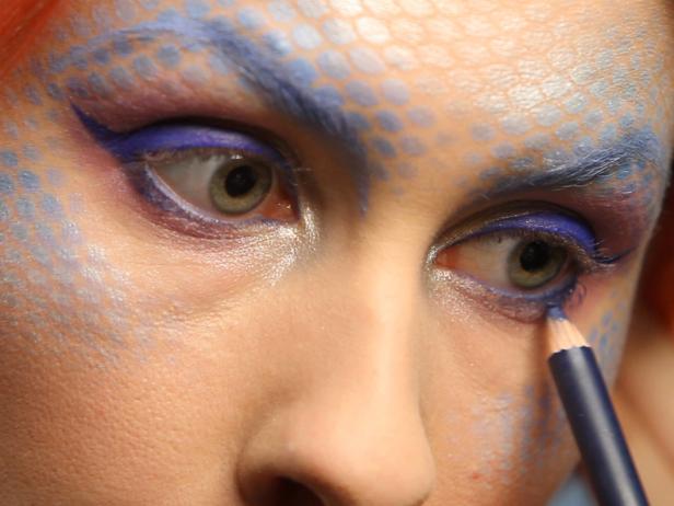Line waterline, the inside bottom of eyelid, with blue pencil liner to match the top eyelids.