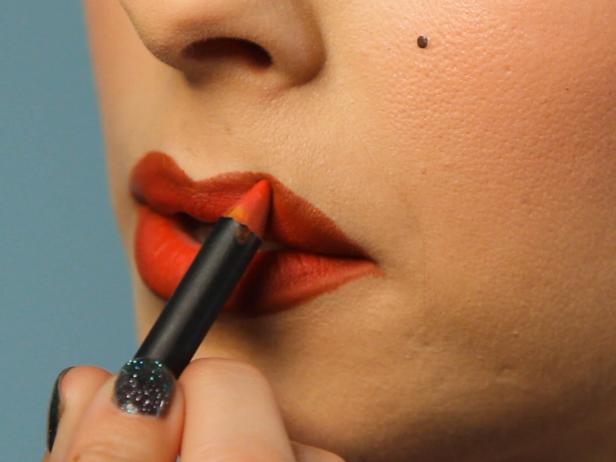 Fill in lips with bright red pencil liner.