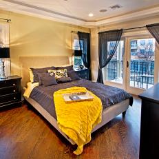 Black-and-Yellow Bedroom With Balcony