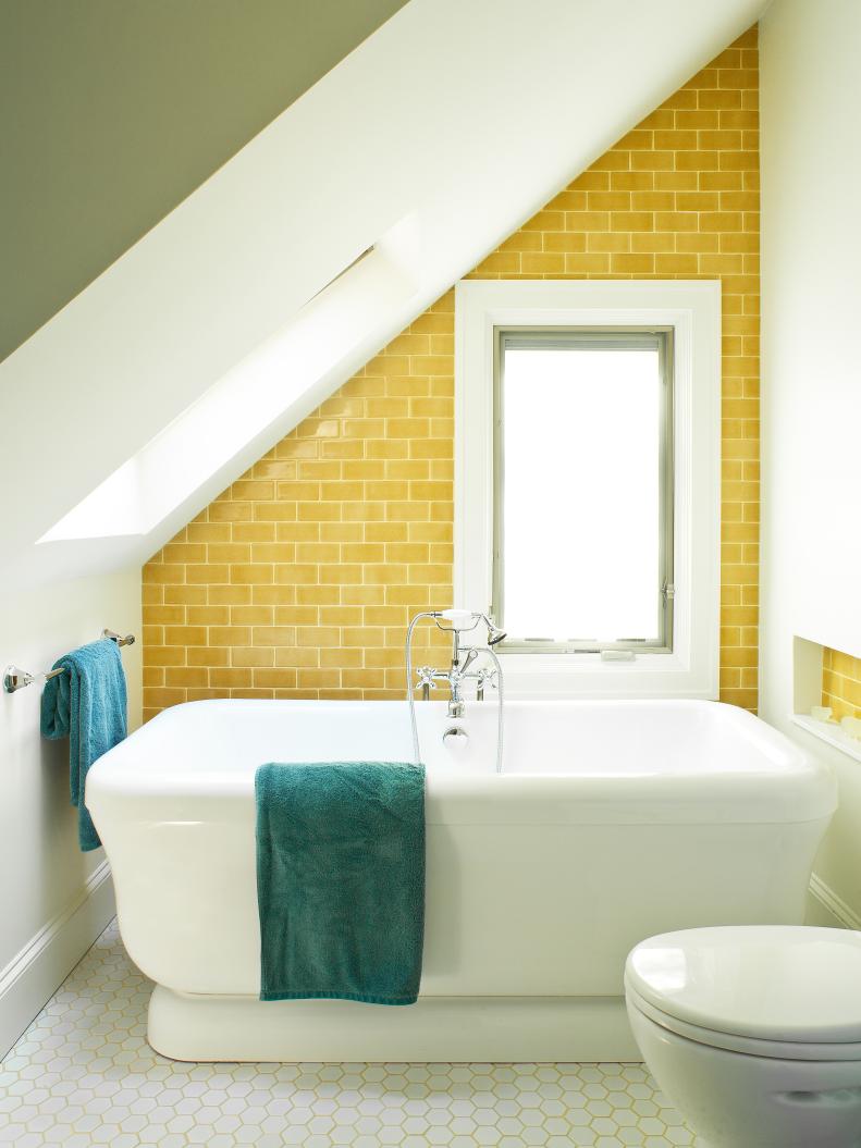 Modern Bathroom With Angled Ceiling, Yellow Wall Tile and Hexagonal Floor Tile