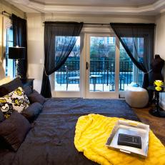 Neutral Bedroom with Bold Yellow and Black Accents and Private Patio