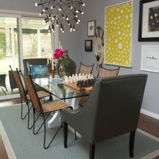 Eclectic Gray Dining Room With Yellow Art, Funky Chandelier