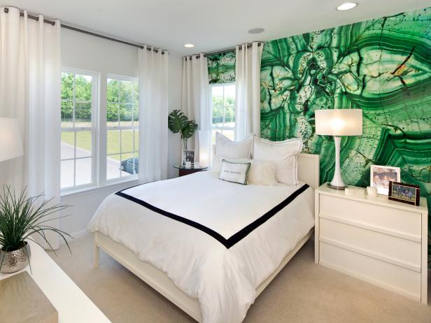 Black and white bedroom deals with green accents