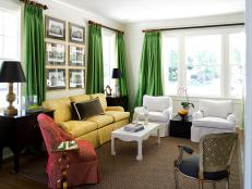 Living Room With Green Curtains, Yellow Sofa, Red Chair & White Chairs