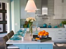Coastal Kitchen With Island, White Cabinetry & Blue Accents