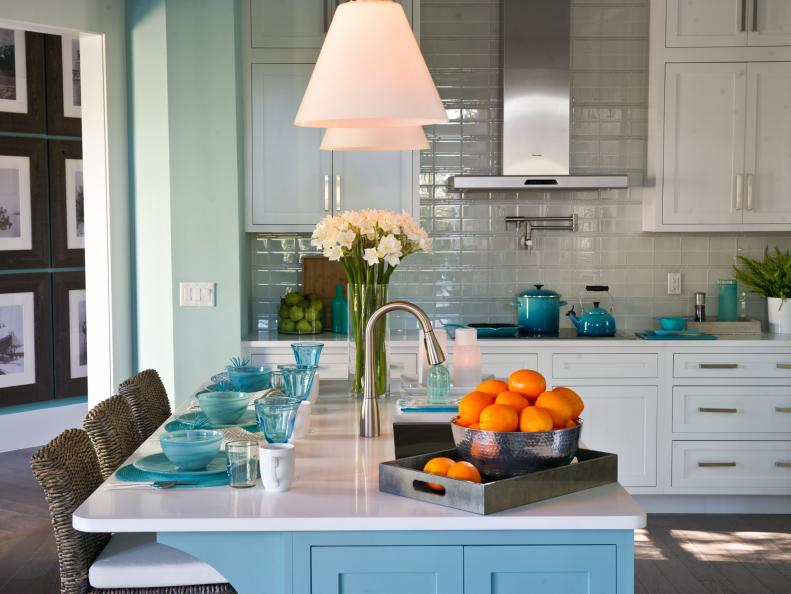 Coastal Kitchen With Island, White Cabinetry & Blue Accents