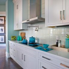 Blue Coastal Kitchen With White Cabinetry