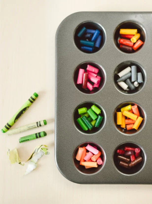 Broken Crayon Pieces Arranged by Color in Mini Muffin Pan