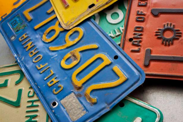 Gather a variety of vintage license plates. You can find them at flea markets, thrift stores and antique malls, and at state and government websites and online auction sites. Be sure you get steel license plates, not aluminum ones.