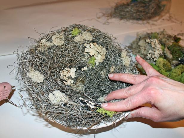 Gluing bark and moss to a faux bird's nest