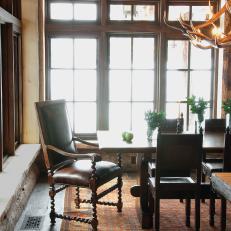 Rustic Dining Room With Antique Leather Chairs