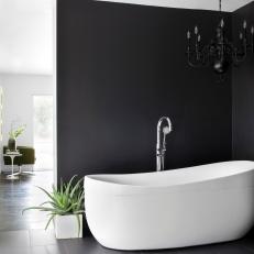 Modern Bathroom With Black Wall and Chandelier