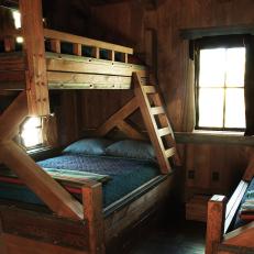 Cabin Bedroom With Rustic Wooden Bunks