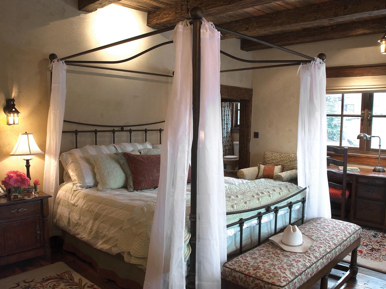 Iron Canopy Bed in Rustic Bedroom HGTV