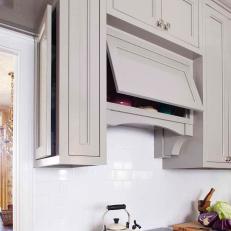 White Kitchen With Overhead Stove Storage