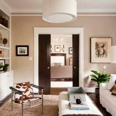 Neutral Living Room With Drum Pendant and Pocket Doors