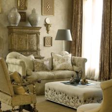Beige Traditional Living Room With Ivory Sofa and Upholstered Ottoman