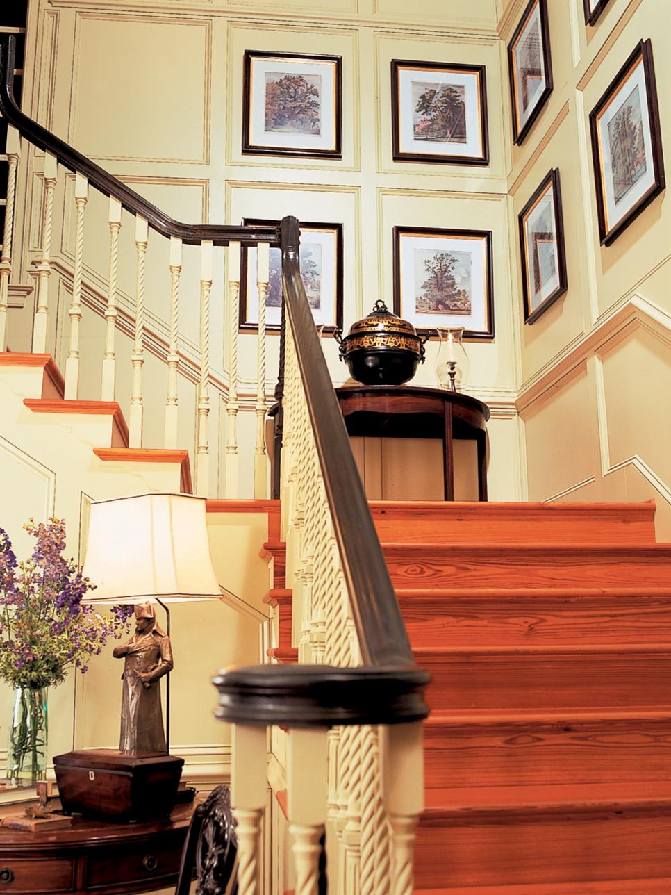 Traditional Staircase with Decorative Landing and Framed Art | HGTV