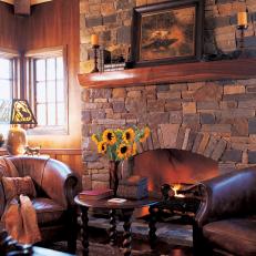 Rustic Sitting Room With Stone Fireplace