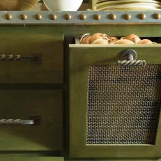 Green Cabinet With Stud Border and Grated Pull-Out Cubby
