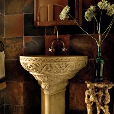 Mediterranean Bathroom with African Slate Covered Walls and Empire Wall Mirror