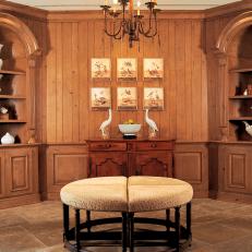 Wood-Paneled Hall With Arched Bookcases