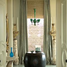 Eclectic Entryway With Stone Pedestals